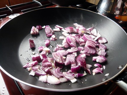 Chopped red onion in pan